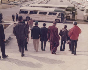 Members of the American Agriculture Movement, walking down the steps of the Capitol in Montgomery, Alabama.