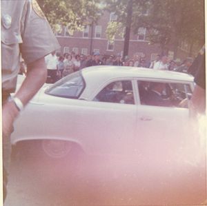 Vivian Malone in car on campus at the University of Alabama in Tuscaloosa.
