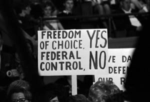 Signs held by audience members at a Concerned Parents rally at the municipal auditorium in Birmingham, Alabama.
