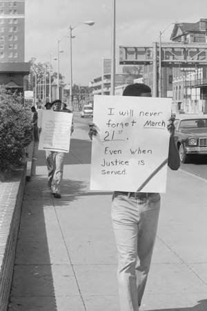 Picketer protesting at the county courthouse in Mobile, Alabama, during the investigation into the murder of Michael Donald.
