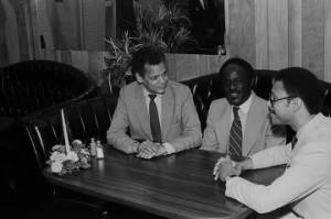 Julian Bond, Robert Battles, and Sanford Bishop seated at a table at Grover's Cafeteria in Mobile, Alabama.