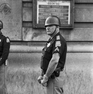 Alabama Highway Patrolman on guard during a civil rights protest in Birmingham, Alabama.
