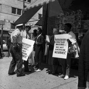 Civil rights demonstrators protesting outside the F. W. Woolworth store in downtown Birmingham, Alabama.