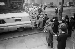 Police officers arresting civil rights demonstrators during a protest march in downtown Birmingham, Alabama.