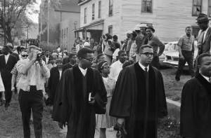 Reverends Nelson H. Smith, John Porter, and A. D. King leading marchers during a civil rights demonstration in downtown Birmingham, Alabama.