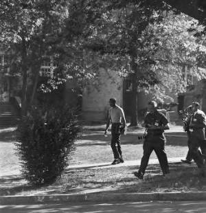 James Hood walking across campus at the University of Alabama.