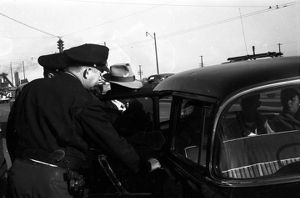 African Americans being arrested after attempting to integrate a bus in Birmingham, Alabama.