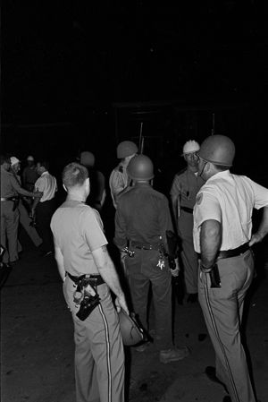 Police officers on Center Street in Birmingham, Alabama, the night Arthur Shores's home was bombed.
