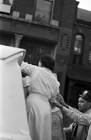 Police officer arresting a civil rights demonstrator during a protest in downtown Birmingham, Alabama.