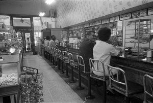 Civil rights demonstrators participating in a sit-in at the H. L. Green lunch counter in Birmingham, Alabama.