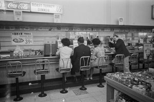 Civil rights demonstrators participating in a sit-in at the H. L. Green lunch counter in Birmingham, Alabama.