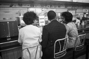 Civil rights demonstrators participating in a sit-in at the H. L. Green lunch counter in Birmingham, Alabama.