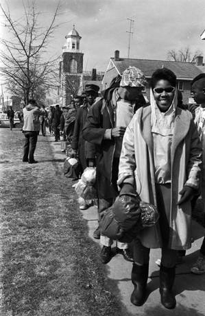 Civil rights marchers lining up on the sidewalk on Sylvan Street in Selma, Alabama, on Bloody Sunday.