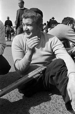 Jim Letherer resting and smoking a cigarette during a stop on the Selma to Montgomery March.