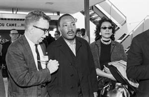 Martin Luther King Jr. speaking to a journalist after arriving at the Montgomery airport during the Selma to Montgomery March.