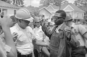 Richard Boone being arrested a during civil rights demonstration, probably at Bailey's Tabernacle CME Church in Tuscaloosa, Alabama.