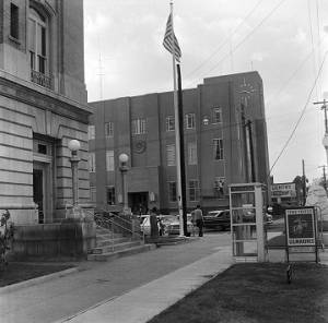Civil rights demonstrator standing in front of the federal building in downtown Selma, Alabama, across the street from the Dallas County courthouse.