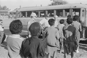 Young African Americans boarding a bus after being arrested for civil rights demonstrations in Selma, Alabama.