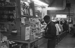 Young African American men eating at a drug store lunch counter in Birmingham or Bessemer, Alabama.