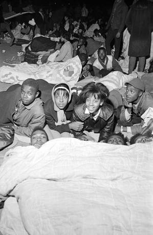 Young civil rights demonstrators lying and sleeping on the ground in Selma, Alabama.