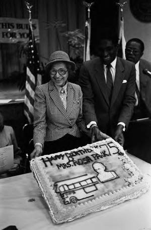 Rosa Parks and Mayor Johnny Ford displaying her birthday cake on Rosa Parks Day in Tuskegee, Alabama.