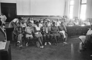 African Americans seated in a courtroom at the Greene County courthouse in Eutaw, Alabama, during a civil rights demonstration.