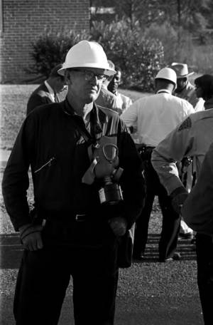 Man, possibly a police officer, standing outside during a civil rights demonstration in Luverne, Alabama.