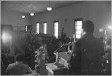 Man, possibly Hosea Williams, speaking to a crowd at Maggie Street Baptist Church in Montgomery, Alabama.