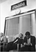 Martin Luther King, Jr., sitting behind the podium during a meeting at Maggie Street Baptist Church in Montgomery, Alabama.