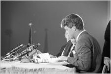 Senator Robert F. Kennedy of the Senate Subcommittee on Employment, Manpower, and Poverty, listening to testimony during a hearing at the Heidelberg Hotel in Jackson, Mississippi.