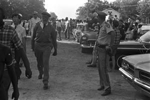 Participants in the "March Against Fear" begun by James Meredith, walking down a dirt road.