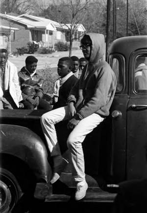 Yvonne Kolb sitting on the side of a pickup truck during a civil rights demonstration in Luverne, Alabama.