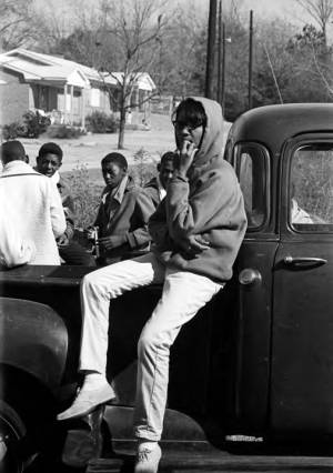 Yvonne Kolb sitting on the side of a pickup truck during a civil rights demonstration in Luverne, Alabama.
