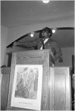 Richard Boone speaking to an audience at First Baptist Church in Eutaw, Alabama.