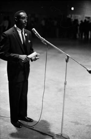 John Hulett speaking to an audience at the National Guard Armory on Dallas Avenue in Selma, Alabama, during a political rally featuring members of SNCC and the Dallas County Independent Free Voters Organization.