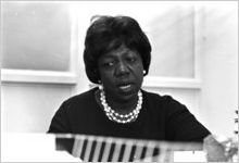 Idessa Williams of the Montgomery Improvement Association, seated at a table during an interview.