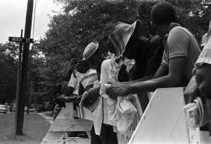 Young men lined up behind a barricade during a civil rights demonstration in Greensboro, Alabama.