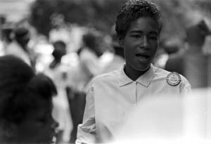 Young woman standing outside during a civil rights demonstration in Greensboro, Alabama.