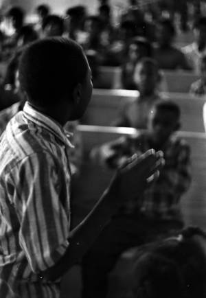 Boy addressing an audience at Harrison Street Baptist Church in Greenville, Alabama, during a student boycott of the Greenville Training School.