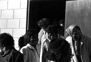 People leaving Harrison Street Baptist Church in Greenville, Alabama, probably after listening to Martin Luther King, Jr., speak.