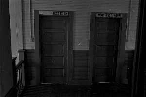 Two restroom doors in a building in Lowndes County, Alabama.