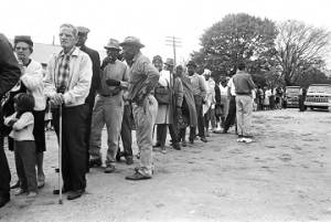 People standing in line outside on election day in Lowndes County, Alabama.