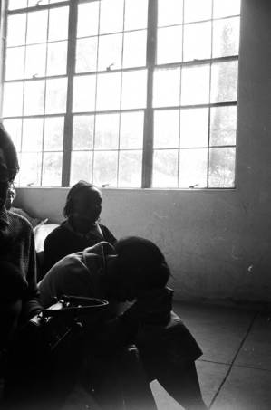 Women seated in an audience during a meeting, probably in an auditorium or gym in Montgomery, Alabama.