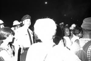 Police Chief Drue Lackey speaking to a crowd on a street in downtown Montgomery, Alabama, during a civil rights demonstration.