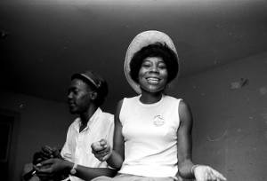 Man and young woman seated on a table during a civil rights meeting in Montgomery, Alabama.