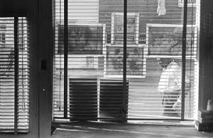 Man walking past the office of the Student Nonviolent Coordinating Committee in downtown Montgomery, Alabama.