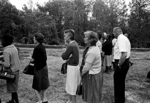 People standing in line outside on election day in Lowndes County, Alabama.