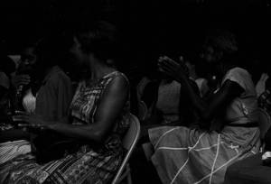 Women in an audience listening to a man speak, possibly before a civil rights demonstration in downtown Montgomery, Alabama.