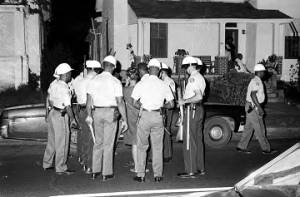 Police officers arresting several young men and women during a civil rights demonstration in Montgomery, Alabama.