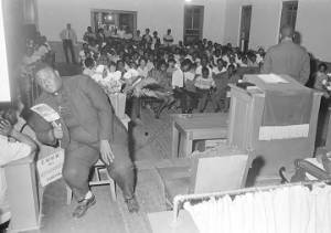 Audience leaving the auditorium of a church building, possibly after a civil rights meeting in Montgomery, Alabama.
